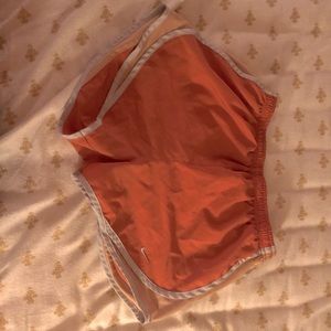 Orange Nike dri-fit shorts